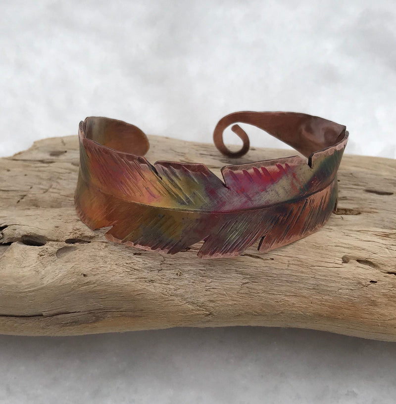 Colorful bracelet perched on driftwood