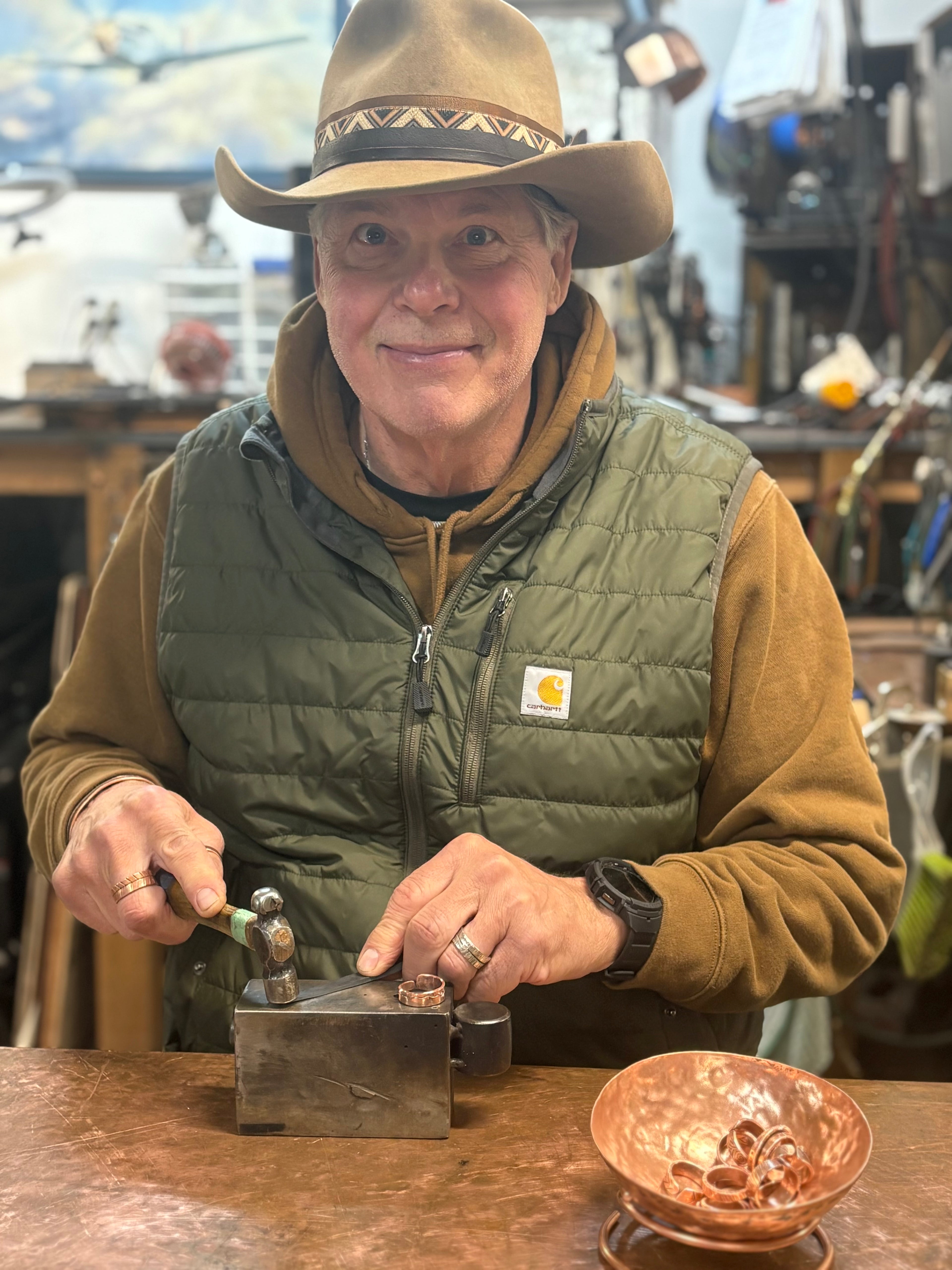 Person working with metal in a workshop setting