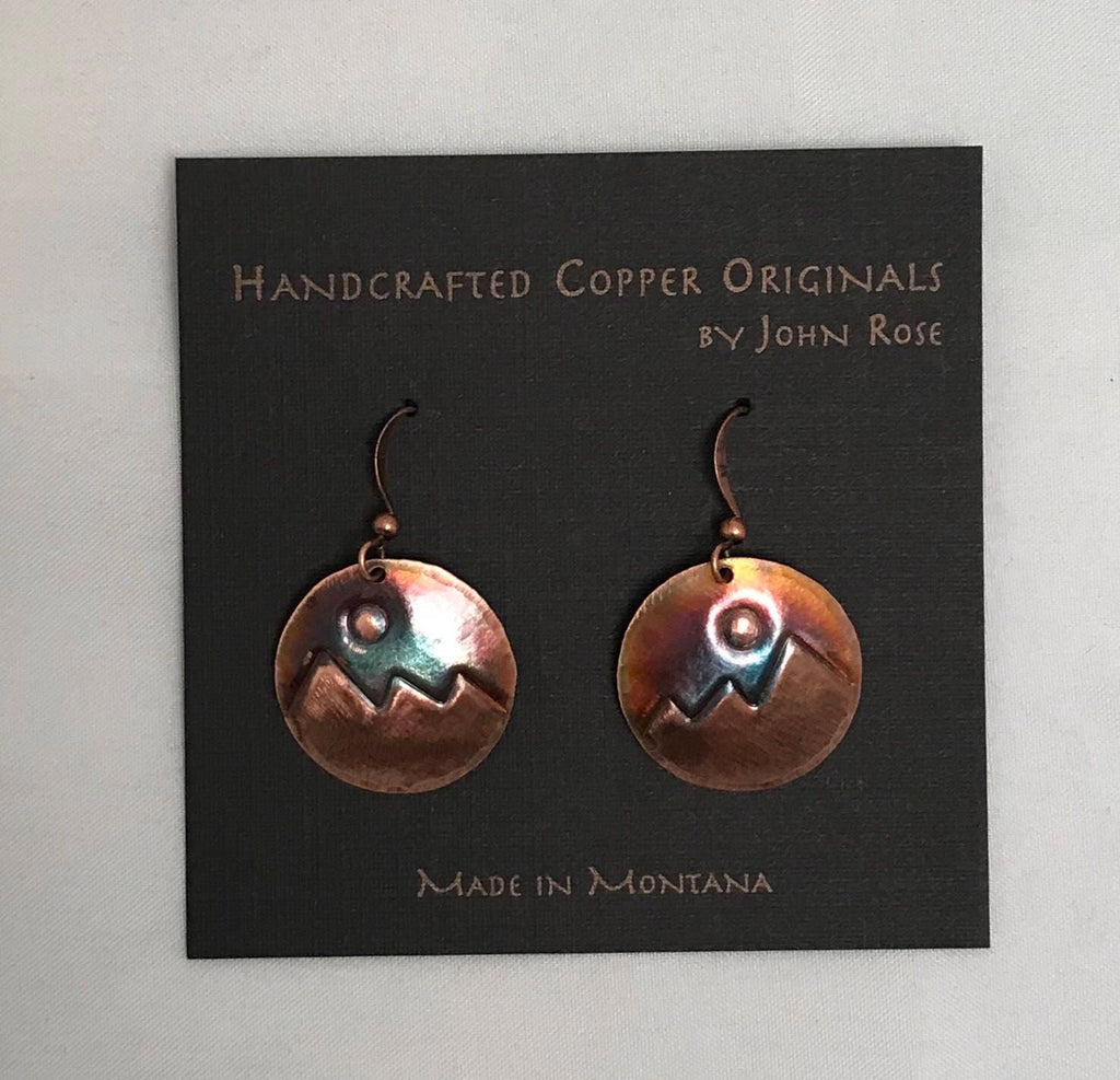 Copper earrings on a card with 'Handcrafted Copper Originals by John Rose' text.
