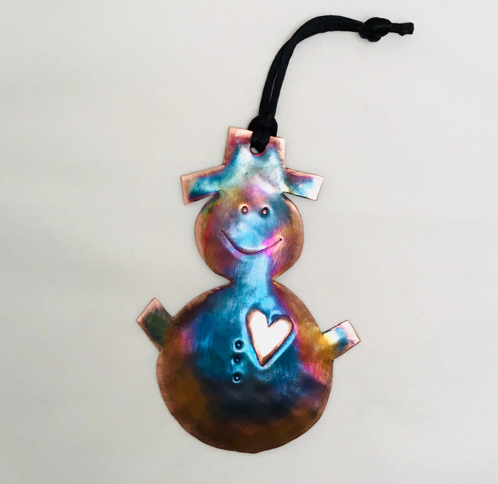 Decorative ornament with a smiley face and heart on a white background